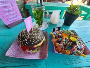 'Mc Cruelty free' burger; iconic rainbow fries; fresh mint tea at Vegan Junk Food Bar - De Pijp in Amsterdam