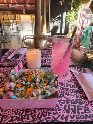 Loaded rainbow fries with Dragonfruit Ice-T at Vegan Junk Food Bar - De Pijp in Amsterdam