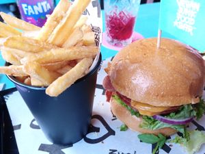 Fries & vegan burger with cheeze, bacon, beef at Vegan Junk Food Bar - De Pijp in Amsterdam