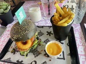 VJFB Fizz (fish) burger, fries and cheesy sauce  at Vegan Junk Food Bar - De Pijp in Amsterdam