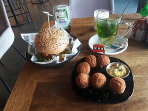 House-style burger, bitterballen and mint tee at Vegan Junk Food Bar - De Pijp in Amsterdam