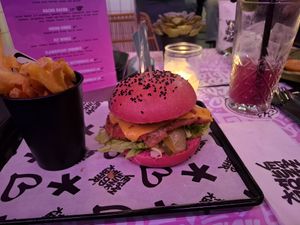 Burger comes with fries included at Vegan Junk Food Bar - De Pijp in Amsterdam