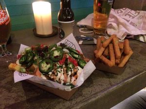 Loaded fries and a side of chickpea fries at Vegan Junk Food Bar - De Pijp in Amsterdam