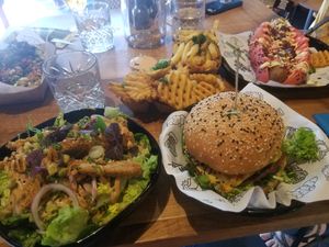 Chkn salad, VJFB burger and Pinky Bratwurst at Vegan Junk Food Bar - De Pijp in Amsterdam