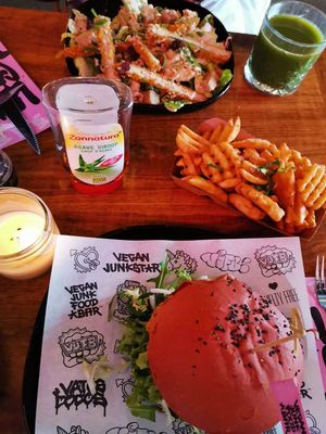 daddy mc chick'n, waffle fries & chicken caesar salad at Vegan Junk Food Bar - De Pijp in Amsterdam