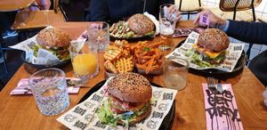 Burgers, waffle fries and sweet potato fries. at Vegan Junk Food Bar - De Pijp in Amsterdam