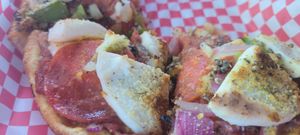 Deep dish pizza with housemade (vg) pepperoni and cheeze at The Pizza Patio in Flagstaff