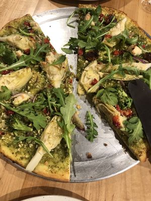 Pizza (plant-based) Half Forgotten Garden with Italian Sausage and the other half Vegan Curse of the Billy Goat at The Pizza Patio in Flagstaff