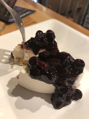 Plant-Based Cheesecake (coconut milk) with Blueberry Compote topping....delicious and not too sweet! at The Pizza Patio in Flagstaff
