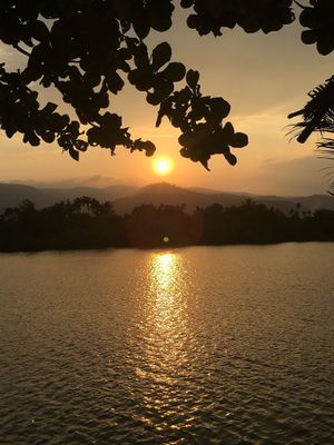 Enjoy the sunset from our riverfront deck and maybe take a dip in the water before enjoying one of our yummy vegan dishes. at Eden Eco Village in Kampot