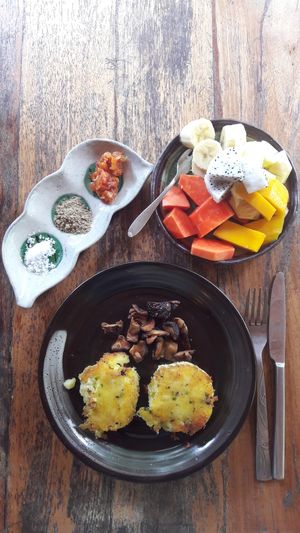 Special breakfast ( vegan option without eggs). Potatoes patties, local mushrooms, fruit salad. Tomato chutney, kampot pepper. at Eden Eco Village in Kampot