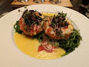 Huge serve of basil pesto with eggplant parmigiana and cheese sauce at The Porterhouse in Killarney