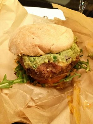 Vegan burger. Sweet potato, quinoa & chilli patty with curried butter beans, guacamole & vegan sriracha mayo at Tribal Burger - Botanic Ave in Belfast