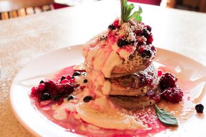 Banana breakfast pancakes with berries and yoghurt at True Story in York