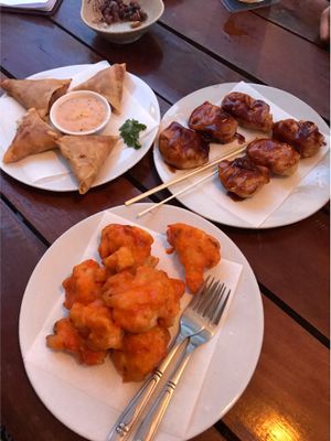 Texas bbq tofu nuggets, spicy cauliflower wings and vegetable samosas  at Moringa in Siem Reap