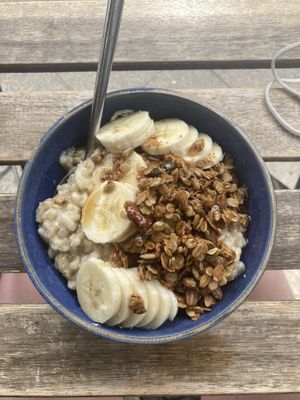 porridge with banana and granola  at Haferkater - Mauerpark in Berlin
