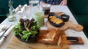 Haskap Berry Grilled Cheese with Mixed Greens. Side of hashbrowns. Iced matcha latte and americano.  at LOV in Laval