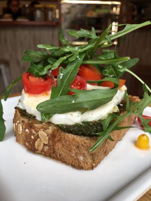 Sourdough multigrain toast with pesto, fresh mozzarella & cherry tomatoes at La Rabona Peruvian Deli in Cusco