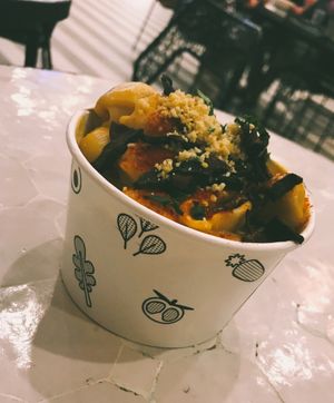 Mac n’ cheese topped with shiitake bacon and vegan parm at Beatnic - Rockefeller Plaza in New York City