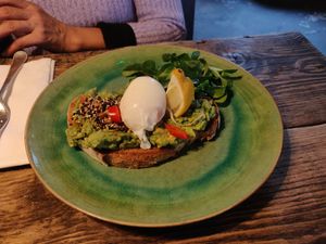 Smashed avocado, toasted sourdough, chili, lime & tomato salsa, watercress, almond dukkha [£8.50] (extra 1.00 for poached egg) - Vegetarian at The Old Bicycle Shop in Cambridge