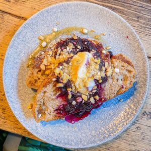 vegan french toast with blueberry compote, creme fraiche, crushed banana chips and syrup at The Old Bicycle Shop in Cambridge