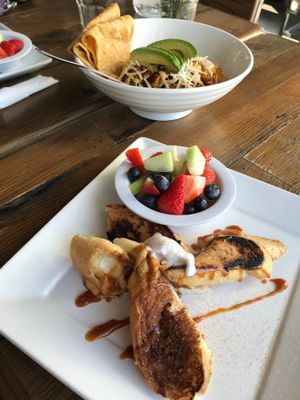 Stuffed French Toast w/ "Drop Food Not Bombs" bowl in background at VegeNation in Henderson
