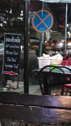 Seats at stret ok not much traffic at Lisa's Cafe in Savannakhet