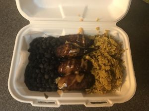 Plato Principal - black beans, yellow rice with sweet plantains and bang bang sauce. Seriously so simple and so delicious. Could have used more bang bang sauce. at Earth to Us  in Durham