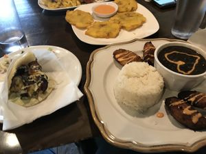 Arepas, maduras, black beans and rice and tostones.  at Earth to Us  in Durham