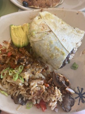 Half a Burrito subbing eggs for tofu added mushrooms and avocado and half a Spud skillet with mushrooms, peppers and soyrizo.    at Snooze - Larimer St in Denver