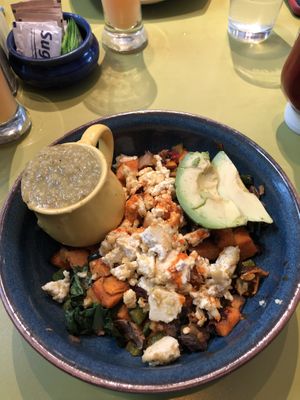 Sweet potato hash, scrambled tofu, mushrooms, poblano peppers, avocado and green chili sauce.  at Snooze - Larimer St in Denver