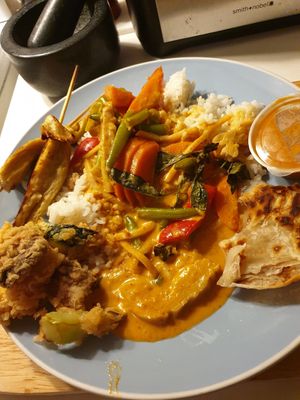 Crunchy veggies, red curry, seitan skewers w/satay, roti at Madame K's Vegetarian - Williamstown in Williamstown