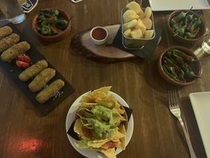 Pea and mint croquettes, nachos, patatas bravas, peppers at FAMA Aperitif Bar in Benalmadena