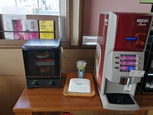 Free coffee! Be careful if you are vegan, they use cow milk for the cafe latte and milk tea. at Prema Bakery in Komaki