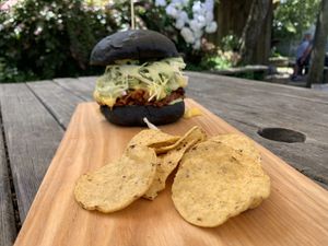Blackjack - BBQ Jackfruit burger. Comes with a side of corn chips that are perfect to eat the extra BBQ Jackfruit with that falls from your burger! 😊 at Okere Falls Store in Rotorua