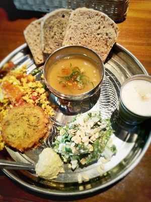 Bread plate with soup, vegan yogourt, humus, potato, salad and crumble tofu. Yummy! at Niceness in Nago