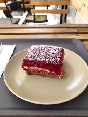 Spelt pastry with coconut cream and raspberries. First two layers were delicious, raspberry part too dense and sweet.. would wish for more coconut cream part. (3.5€) at Avokado in Koper