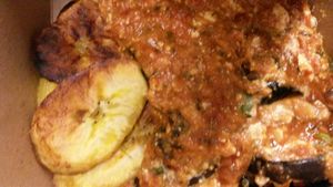 Takeaway Aubergine Parmigiana with plantain. at Plantbase Cafe in South West London