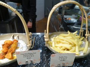 Crispy Spicy Monkey head mushroom skewer and truffles fries at Grove Cafe 素林 - Paya Lebar in Central Singapore