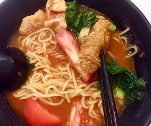 Tomato soup ramen. Ingredients: tomato, dark green leafy vegetable, monkey head mushroom, a piece of fried bean curd skin thingy. The soup was thick and heavy, making the meal a very filling one. at Grove Cafe 素林 - Paya Lebar in Central Singapore