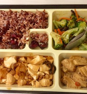 Bento box. Brown rice with broccoli, tofu, monkey head mushrooms. at Grove Cafe 素林 - Paya Lebar in Central Singapore