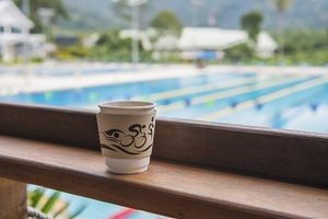 Taking a nice coffee with swimming pool scene at Booster Deli & Cafe in Phuket
