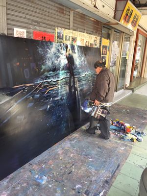 Street artist just on the corner at Happy Green - Tainan Wei Le Lu in Tainan