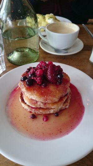Vegan coconut pancakes with berries at The Handle Bar in Oxford