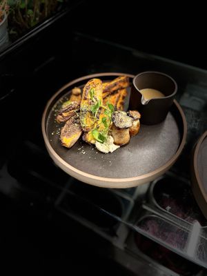 Oven-baked sweet potato with king oyster mushroom & miso gravy  at Plant Power Food in Copenhagen