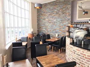 Inside Café Piccolo, with the best sea view at Cafe Piccolo in Weymouth