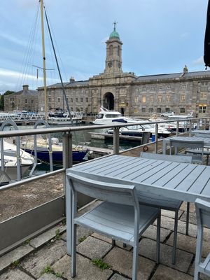 Outside seating overlooking harbour, yachts and sea views at Wagamama in Plymouth