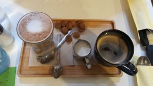 Our coffees (oat latte and black) at Li O Lait in Bruges