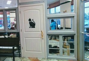 The door to the cat haven. It's separate and there is a small fee to enter that side. Just book online in advance at VegaBoo Cat Haven in Regina