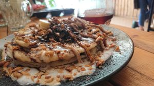 Vanilla pancake with coconut cream, chocolate, peanuts, bananas.... at Brew and Breakfast in Da Lat
